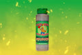Good Fire hot sauce bottle on green background