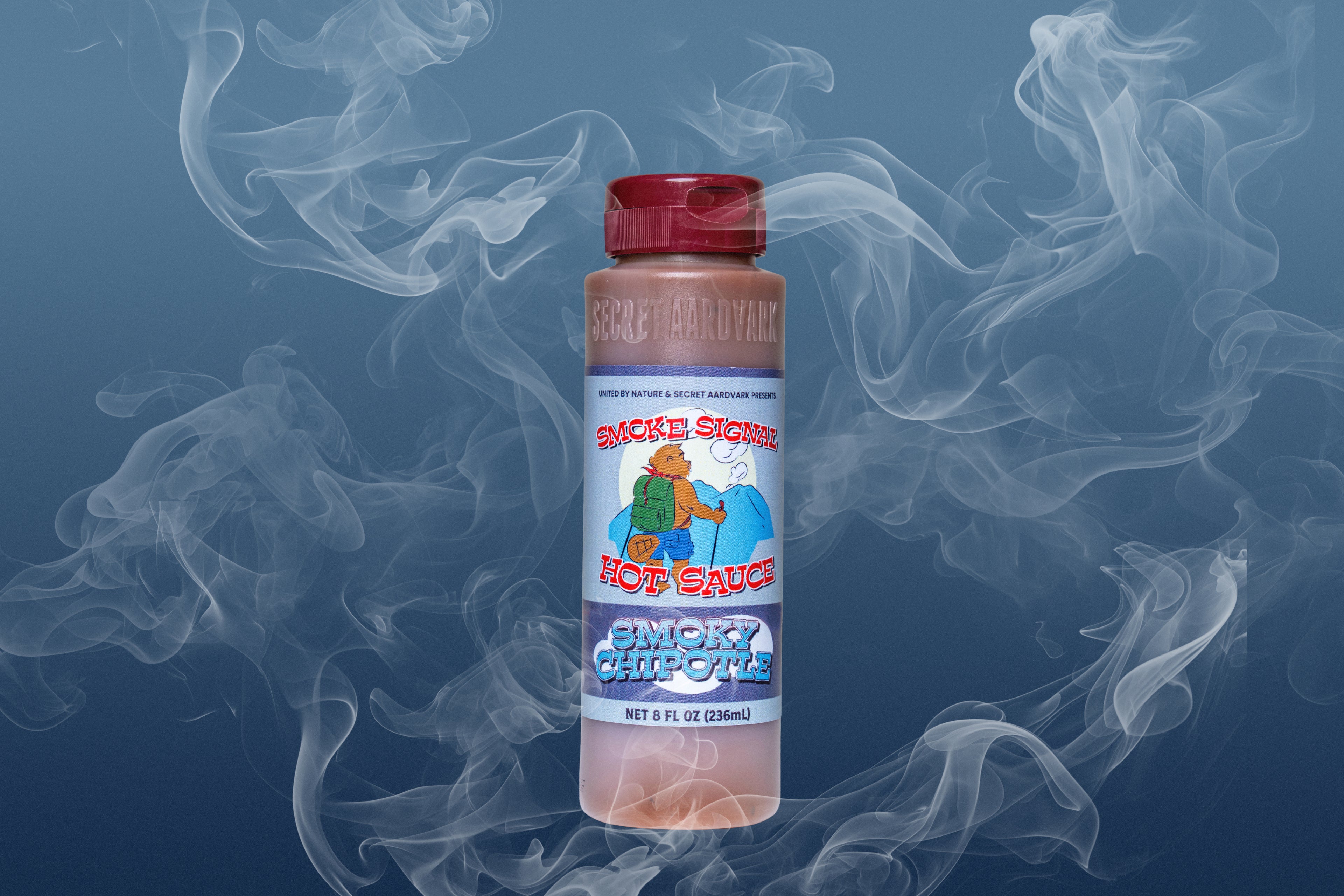Smoke Signal hot sauce bottle on gray background